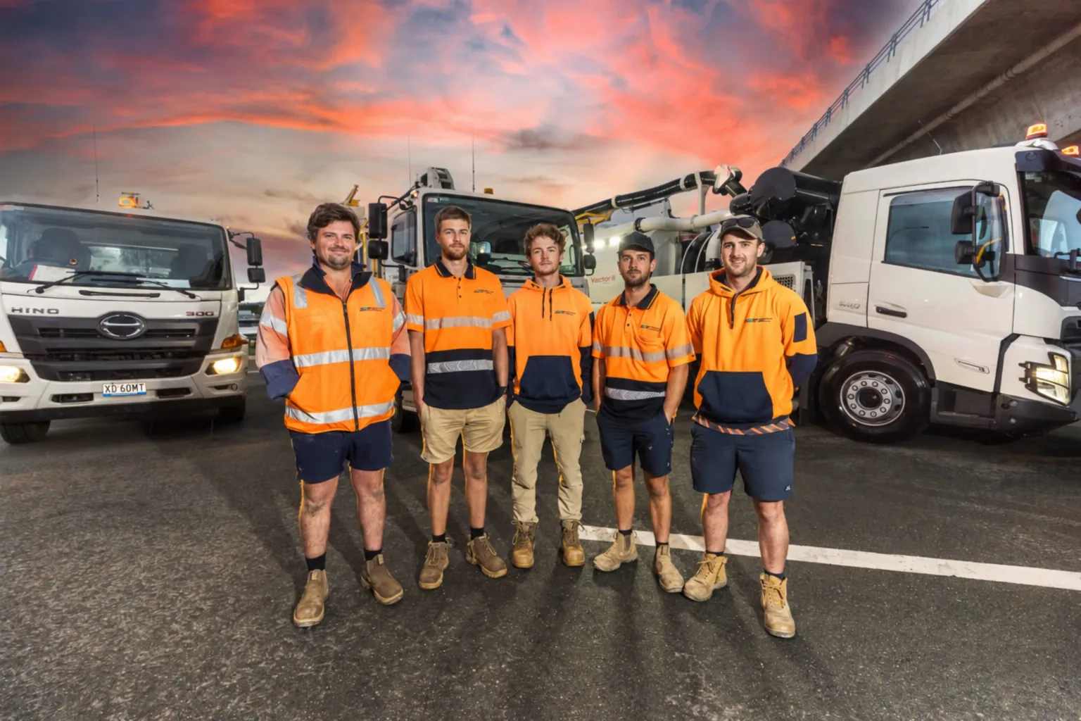 The Eurobodalla Coast Pumpouts team in front of the fleet at dusk